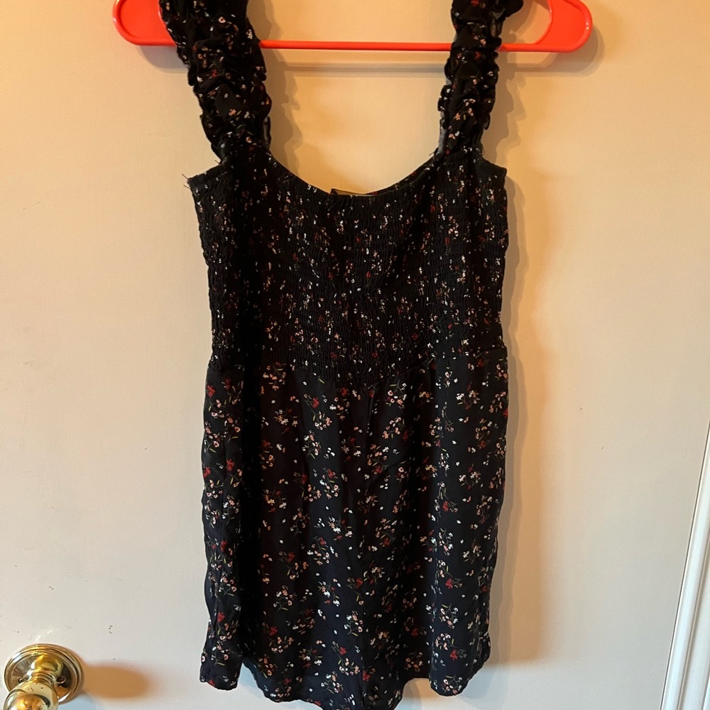 Short rompers. Shows large I would size down to a medium.